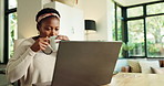 Coffee, happy and black woman in home with laptop for newsletter or internet blog in morning. Cappuccino, computer and African female person drinking latte and reading online celebrity gossip.