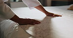 Bedroom, hands and making bed in home, chores or routine for maintenance of mattress, tidy and neat. Cleaning, morning and organizing fresh bedding, housework and person with blanket in apartment