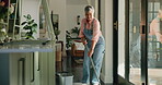 Dancing, woman and spring cleaning with mop, home and prevention of bacteria in apartment and germs. House, disinfection and removal of dirt with bucket, smile and fun for mature person with chores