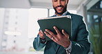 Office, happy and business man on tablet for financial report, online results and stock market news. Low angle, corporate and person on digital tech for finance review, stocks update and website