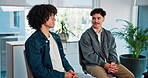 Men, discussion and support group with therapy in workplace for mental health, listen and smile at office. Business people, talk and happy in circle, empathy and solidarity in counselling session