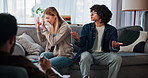 Therapy, conflict and couple on sofa argue for relationship help, counseling and partnership issue. Psychology, upset and man with woman in discussion, argument and frustrated for emotional burnout