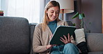 Smile, woman and relax with tablet at house for browsing, social media and website search on sofa. Happy, female person and digital for reading blog, streaming video and funny notification of weekend