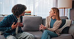 Therapy, argue and couple on sofa talking for relationship help, counseling and partnership issue. Psychology, upset and man with woman in discussion, argument and conflict for emotional burnout