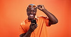 Black man, phone and happy with surprise in studio with sunglasses, gossip and contact by background. African person, smartphone and app with shock, social media and good news with mockup space