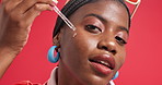 Face, black woman and serum for skincare in studio for beauty, hydration and collagen treatment. Portrait, person and laugh with pipette for facial oil, dermatology glow or wellness on red background