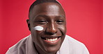 Cream, skincare and face of black man on red background for skin hydration, wellness and facial care. Dermatology, spa and portrait of person with moisturizer, lotion and creme for health in studio