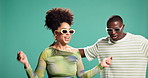 African couple, happy and dancing in studio with sunglasses, fashion and excited by background. People, man and woman with movement, rhythm and partner with smile for trendy style with celebration
