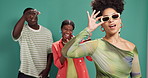 Face, fashion or sunglasses with influencer woman and fans on green background for social media. Afro, shades and style with confident person in studio to model clothes outfit for content creation