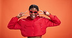 Black woman, smile and peace sign in studio with sunglasses, pride and excited for style background. African person, gen z girl and happy in trendy fashion with icon, v symbol and emoji for win