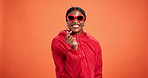 Happy, love and face of black woman by studio background with gratitude hand sign or emoji. Smile, sunglasses and African person with mini heart gesture for support, care or kindness by mockup space.