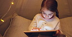 Child, tablet and night in tent at house for streaming movies, watching cartoons and bedtime routine. Kid, scroll and digital app for surfing internet, playing games and download ebook for storytime