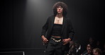 Man, model or runway with style for fashion show, garment collection or designer brand. Male person, crowd or audience with clothing line or outfit for publicity or new fashionable trend on walkway