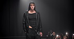 Fashion show, stage and man walking or modeling with designer clothes, luxury collection or couture. Runway, catwalk or event with audience and male model with elegance, style and trendy design