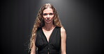 Studio, woman and face with dress for runway, public event and presentation of fashion with mockup. Female person, model and portrait with pride for clothing show, designer brand and black background