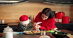 Mom, child or piping cookies with christmas treats, decorations or santa snacks in kitchen at home. Mother, kid or daughter baking with help for festive preparation or meal prep on december holiday