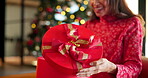 Christmas, gift and surprise with hands of woman for box, festive season and excited. Merry xmas holiday, celebration and vacation with person and present in living room of home for tradition