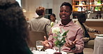 Couple, dating and conversation in restaurant with wine for drink, romance or anniversary celebration. Hospitality, talking and fine dining with man, woman and romantic dinner for valentines day