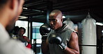 Gym, boxer and men with coach, self defense or fight with gloves for training, wellness or practice. Boxing, fitness and athlete with personal trainer for sport, people or preparation for competition