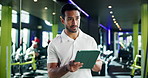 Fitness, tablet and thinking with man in gym for development, planning or sports training. App, exercise or idea and personal trainer in health club to update system with workout program or schedule
