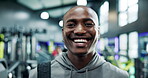 Face, fitness and smile with black man in gym for training or workout as professional athlete. Exercise, health and wellness with happy person in sports club for development, performance or progress