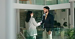 Hiring, handshake and business people in workplace, recruitment and onboarding with welcome. Agreement, man and woman with discussion, shaking hands and greeting with hello, partnership and thank you