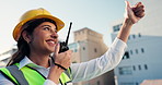Construction, radio and woman in city for building inspection, instructions and maintenance. Civil engineering, architecture and person with communication for feedback, infrastructure and renovation