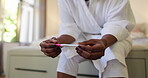 Hands, waiting or woman with pregnancy test on bed for fertility news, stress or panic for results. Nervous, person and anxiety with stick in house for ivf, ovulation planning and infertility risk