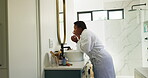Beauty, black woman or check face in mirror for skincare results, skin hydration or getting ready. Dermatology, person or routine inspection in bathroom for anti aging treatment, grooming or wellness