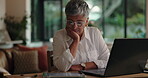 Laptop, remote work and tablet with unhappy woman in home for reading information or research. Burnout, computer and deadline with mature freelancer in apartment for small business compliance