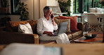 Laughing, laptop and phone call with freelance woman on sofa in living room of home for remote work. Communication, computer and funny with mature person in apartment for mobile discussion at night