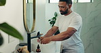 Happy man, washing hands and bathroom with water for hygiene, skincare or disinfection at home. Male person, rinse and tap with liquid, sink or faucet for cleaning skin, bacteria or germ removal