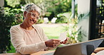 Documents, success and laptop with old woman in home for retirement savings, pension asset and budget. Tax return, dance and loan approval with senior person outdoor for online finance and winner
