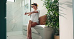 Skincare, bathroom and woman with body cream for beauty, shine and glow. Home, apply lotion and happy girl with cosmetics on arm for hydration, moisturizer or sunscreen for dermatology with self care