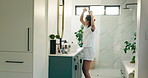 Woman, hairstyling and dance with mirror in bathroom for morning, makeover or routine in home. Smile, phone and excited with foam hair curling rods in apartment for haircare, getting ready or date