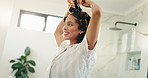 Hair care, curls and woman dancing in bathroom for morning routine, home or to start day. Rods, curlers and house mirror with happy african person for styling, hairstyle or excited for growth results