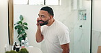 Smile, man and check face in mirror for skincare results, natural beauty and facial benefits. Person, reflection and inspection of smooth skin, treatment and dermatology shine for self care at house