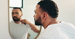 Man, beauty or shaving beard in bathroom for morning routine, grooming or facial care. Hair removal, mirror or person in home with electrical machine for dermatology, skincare or cleaning hygiene
