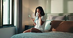 Home, girl and drinking coffee with phone on bed for reading online news, morning routine or scroll. Relax, woman or caffeine with smartphone in bedroom for social media, internet browsing or texting