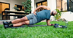 Fitness, side plank and man outdoor for workout, training or stretching for core strength. Health, wellness and male person with exercise for ab muscles, balance or activity in backyard at home.