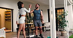 Woman, man and squat with fitness, high five and exercise goal with growth for leg muscle on patio. Couple, teamwork and training with challenge, stretching and development for glutes in morning