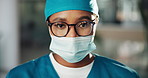 Face mask, surgeon and woman with compliance in hospital for healthcare, wellness and safety. Portrait, doctor and medical professional with ppe, scrubs and surgery employee for support in clinic