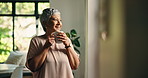 Mature woman, coffee and smile in home by window for reflection, memory or start morning in lounge. Person, tea cup and happy for perspective, thinking or inspiration in living room with mug at house