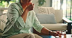 Mature woman, medicine and drinking water in home for wellness, nutrition or supplement for health. Female person, pill box and glass for chronic treatment, routine and prescription drugs at house