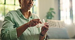 Mature woman, medicine and pill box in home for wellness, vitamins or supplement for health. Female person, medication and container for chronic treatment, routine and prescription drugs at house