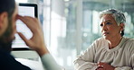 Mature woman, doctor and consultation with computer for health diagnosis or results at hospital. Female person, man and talking with patient for medical explanation or information at clinic desk