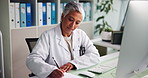 Doctor, computer and mature woman writing notes for prescription, health report or research. Clinic, paper or medical professional with healthcare information, schedule or check results for diagnosis