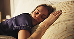 Sleeping, fatigue and woman on bed with peace, calm and dreaming in bedroom with pillow in apartment. Nap, relax and cozy rest on mattress with tired, morning comfort and weekend break in house