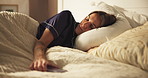 Sleeping, comfort and woman on bed with peace, calm and dreaming in bedroom with pillow in apartment. Nap, relax and cozy rest on mattress with tired, morning fatigue and weekend break in house