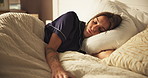 Sleeping, comfort and woman on bed with fatigue, calm and dreaming in bedroom with pillow in apartment. Nap, relax and cozy rest on mattress with tired, morning peace and weekend break in house